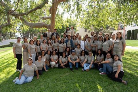 Vivid Life Worker Owners and Partners together standing outside below a tree